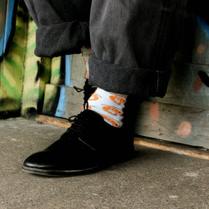 Person wearing Prawn Crew Socks in aqua and orange cotton