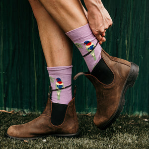 Person wearing Rainbow Lorikeet Crew Socks in orchid cotton