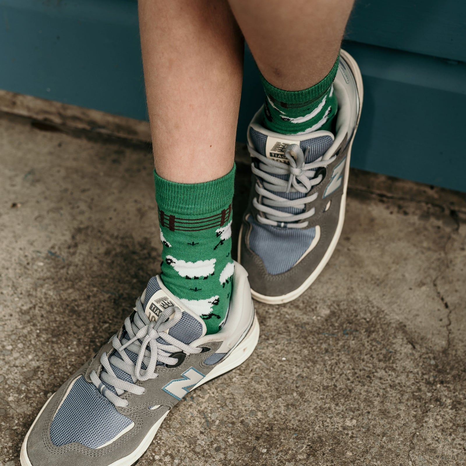 The Black Sheep Crew Socks. Green socks with black sheep pattern, fun novelty design