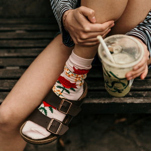 Person wearing Waratah & Wattle Crew Socks in pink cotton